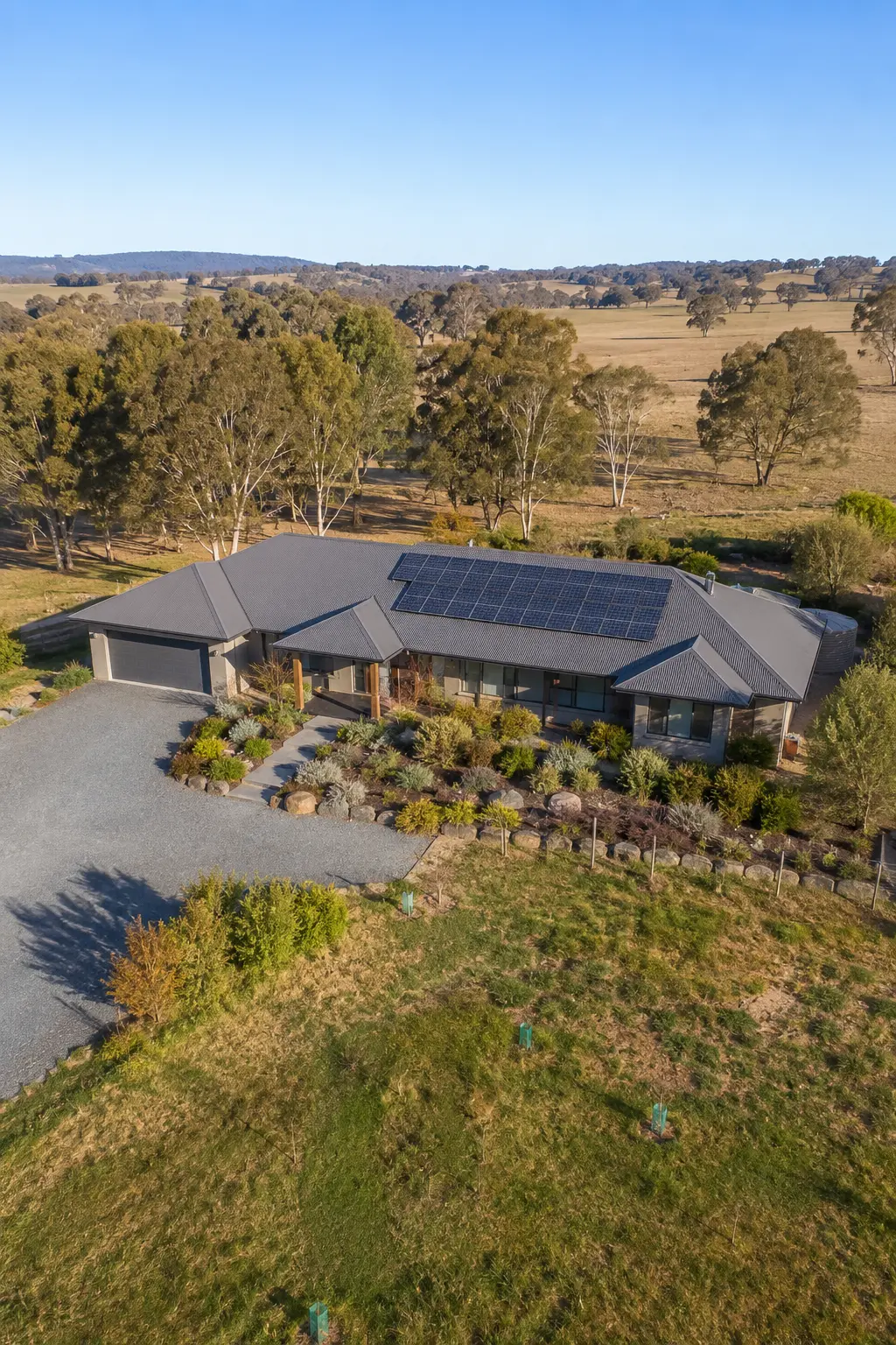 Aerial view of a rural property near Armidale NSW with solar panels installed on the roof