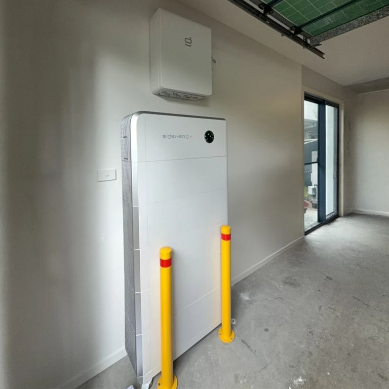 Sigenergy battery install with safety bollards in a garage