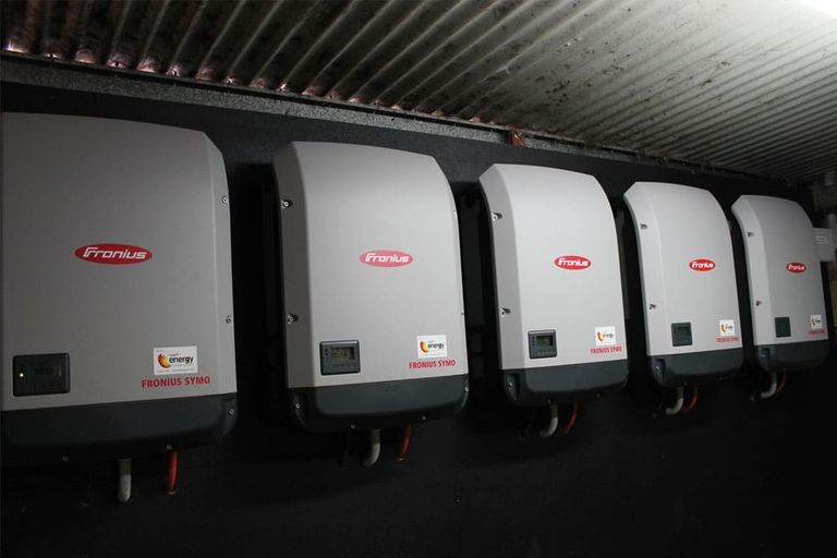 Five Fronius Symo inverters in a commercial plant room