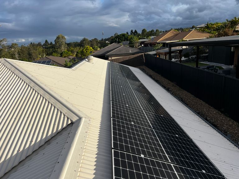Close view along a row of freshly installed solar panels