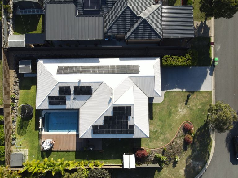 Top down drone view of a large hip roof solar layout
